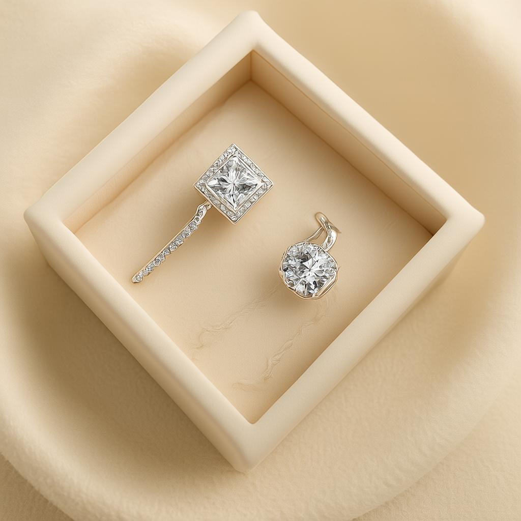 Elegant diamond ring and earring displayed in a cream-colored jewelry box, perfect for jewelry care guide.
