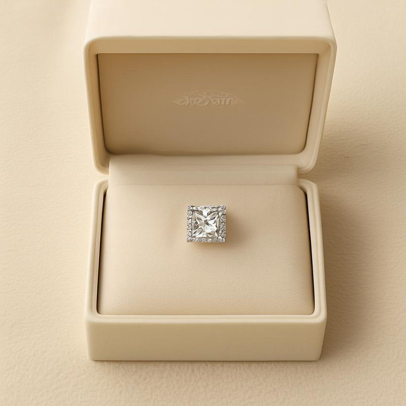 Stunning diamond ring displayed in a cream jewelry box for a luxury buying experience.