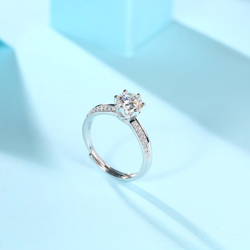 Close-up of 1ct moissanite stone in wedding ring - brilliant cut sparkle, 925 sterling silver band