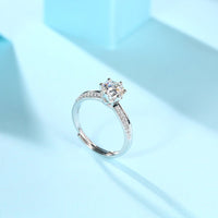 Close-up of 1ct moissanite stone in wedding ring - brilliant cut sparkle, 925 sterling silver band