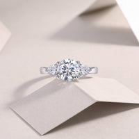 Three-stone ring detail shot - side stones and band setting, 925 sterling silver