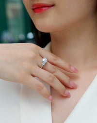 Close-up of three-stone ring center stone - brilliant cut sparkle, 925 sterling silver