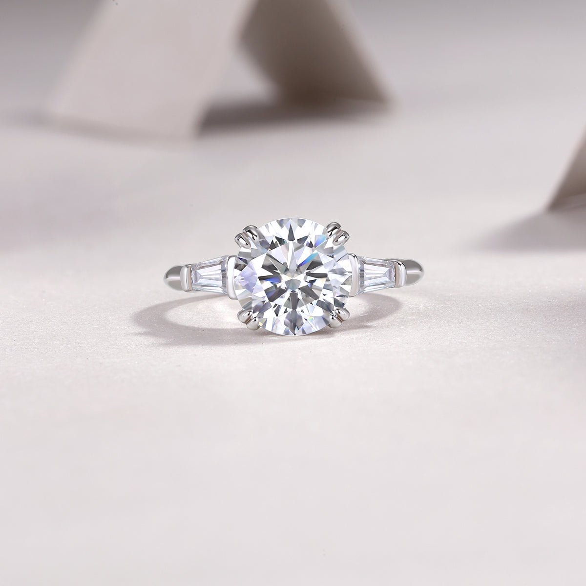 3ct moissanite ring on hand/wrist - lifestyle shot showing large stone scale, platinum-plated 925 silver