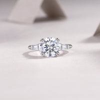 3ct moissanite ring on hand/wrist - lifestyle shot showing large stone scale, platinum-plated 925 silver
