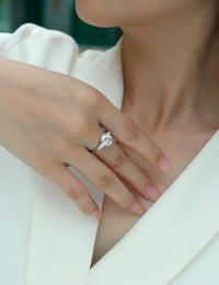 Close-up of 3ct moissanite stone in ring - brilliant cut sparkle, platinum-plated 925 sterling silver