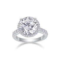 5ct moissanite halo ring on hand/wrist - lifestyle shot showing halo sparkle, platinum-plated 925 silver