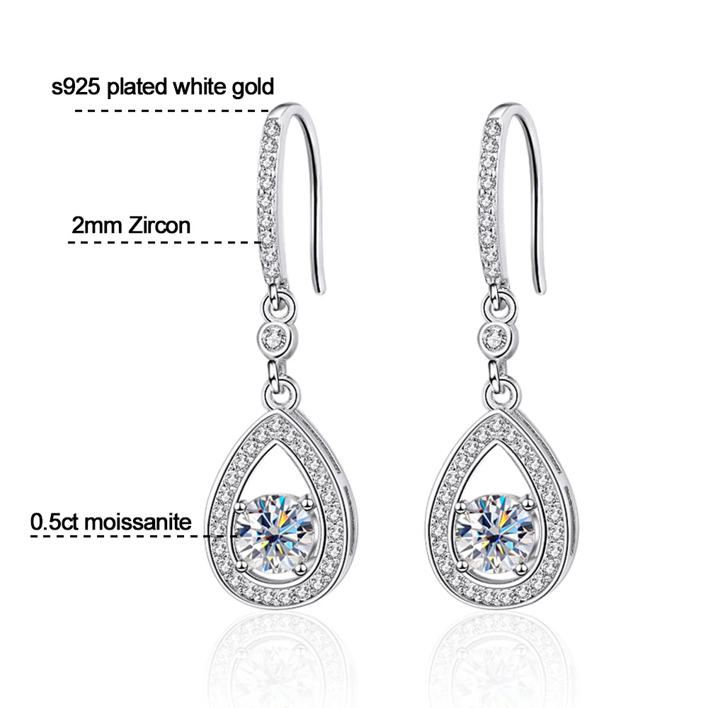 Timeless drop design. Sparkling pear-cut moissanite in a graceful halo setting for effortless elegance. - Diamond-Lab