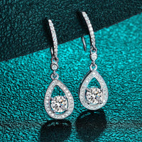 Timeless drop design. Sparkling pear-cut moissanite in a graceful halo setting for effortless elegance. - Diamond-Lab