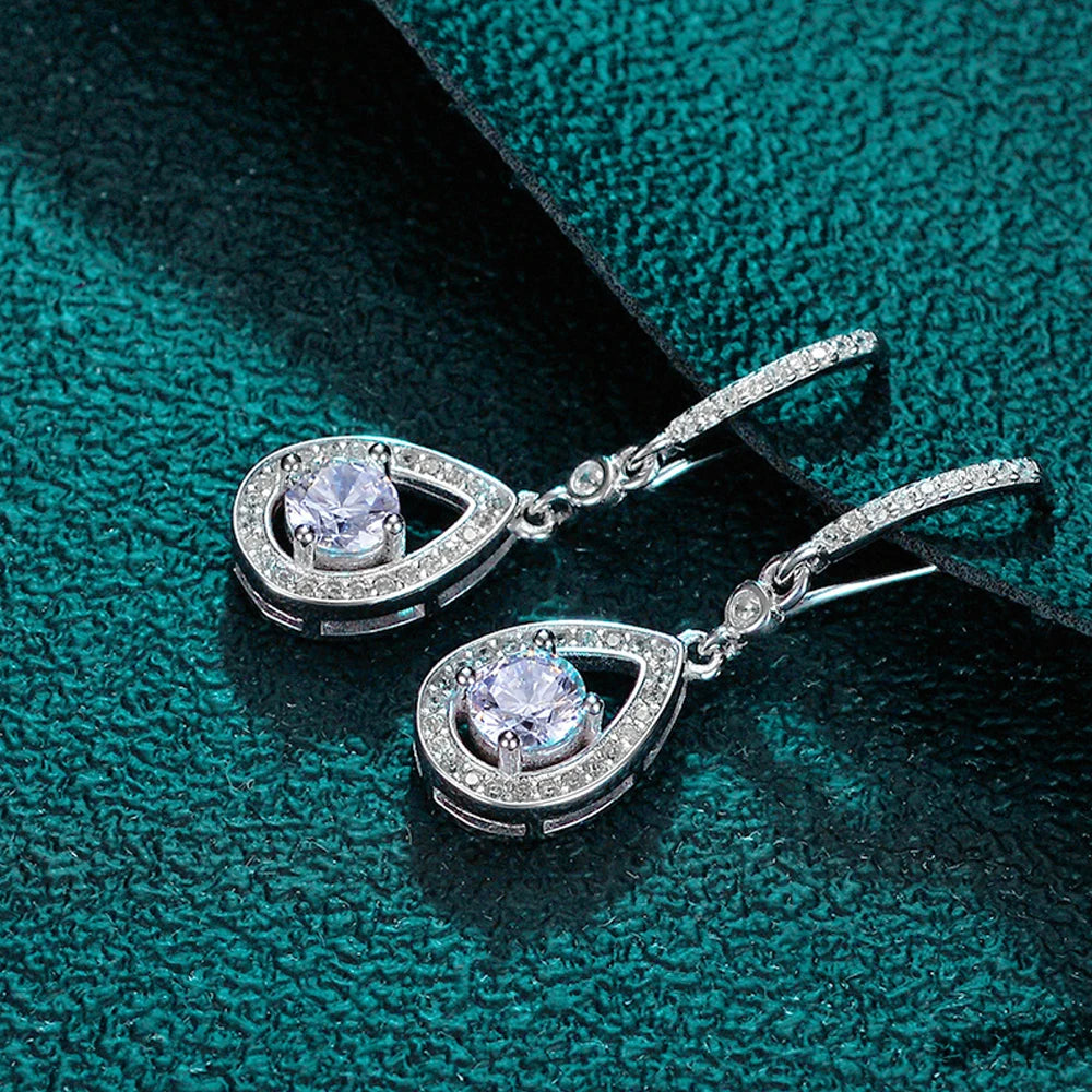 Timeless drop design. Sparkling pear-cut moissanite in a graceful halo setting for effortless elegance. - Diamond-Lab