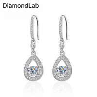 Timeless drop design. Sparkling pear-cut moissanite in a graceful halo setting for effortless elegance. - Diamond-Lab
