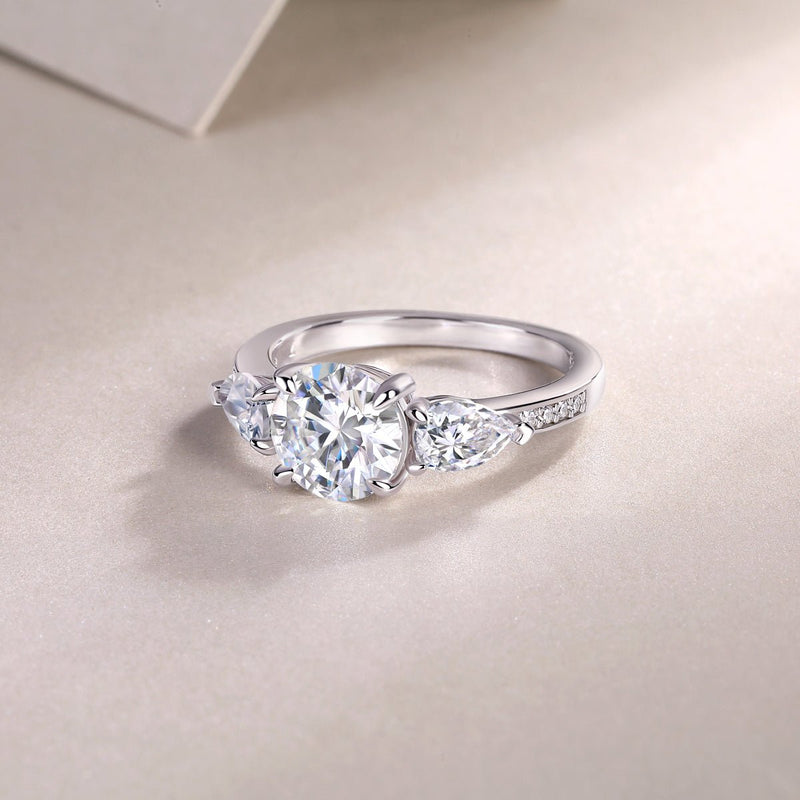 Three-stone engagement ring detail shot - side stones and band setting, S925 sterling silver