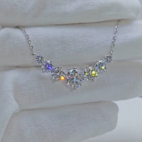 Moissanite necklace in 925 sterling silver with 18k white gold plating, featuring a brilliant center stone and zircon accents.