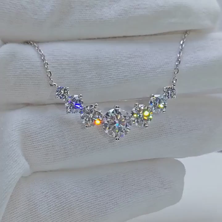 Moissanite necklace in 925 sterling silver with 18k white gold plating, featuring a brilliant center stone and zircon accents.